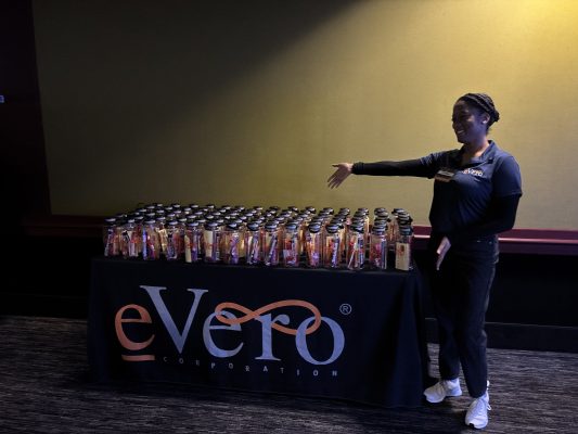 eVero employee displays water bottles on table