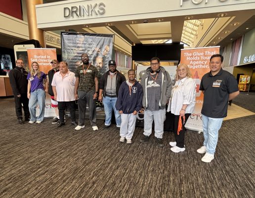 eVero employees and event attendees pose for group photo