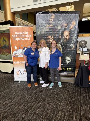 evero employees in front of Thunderbolts poster
